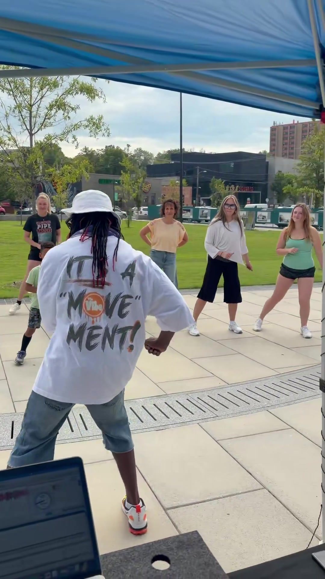 DJ D. Sewell leading an outdoor dance class at the Upper Ramble